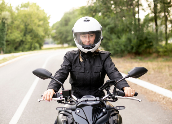Girl on the road on a motorcycle